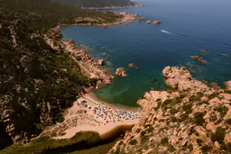 A turquoise cove and pale granite coastline in Sardinia.